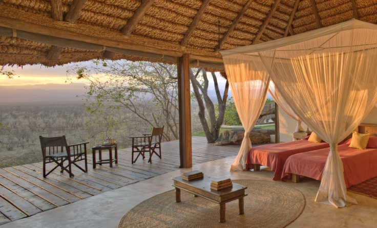 Luxury tented camp perched above a remote savannah